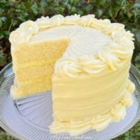 Sliced Lemon Cream Cake on a pedestal