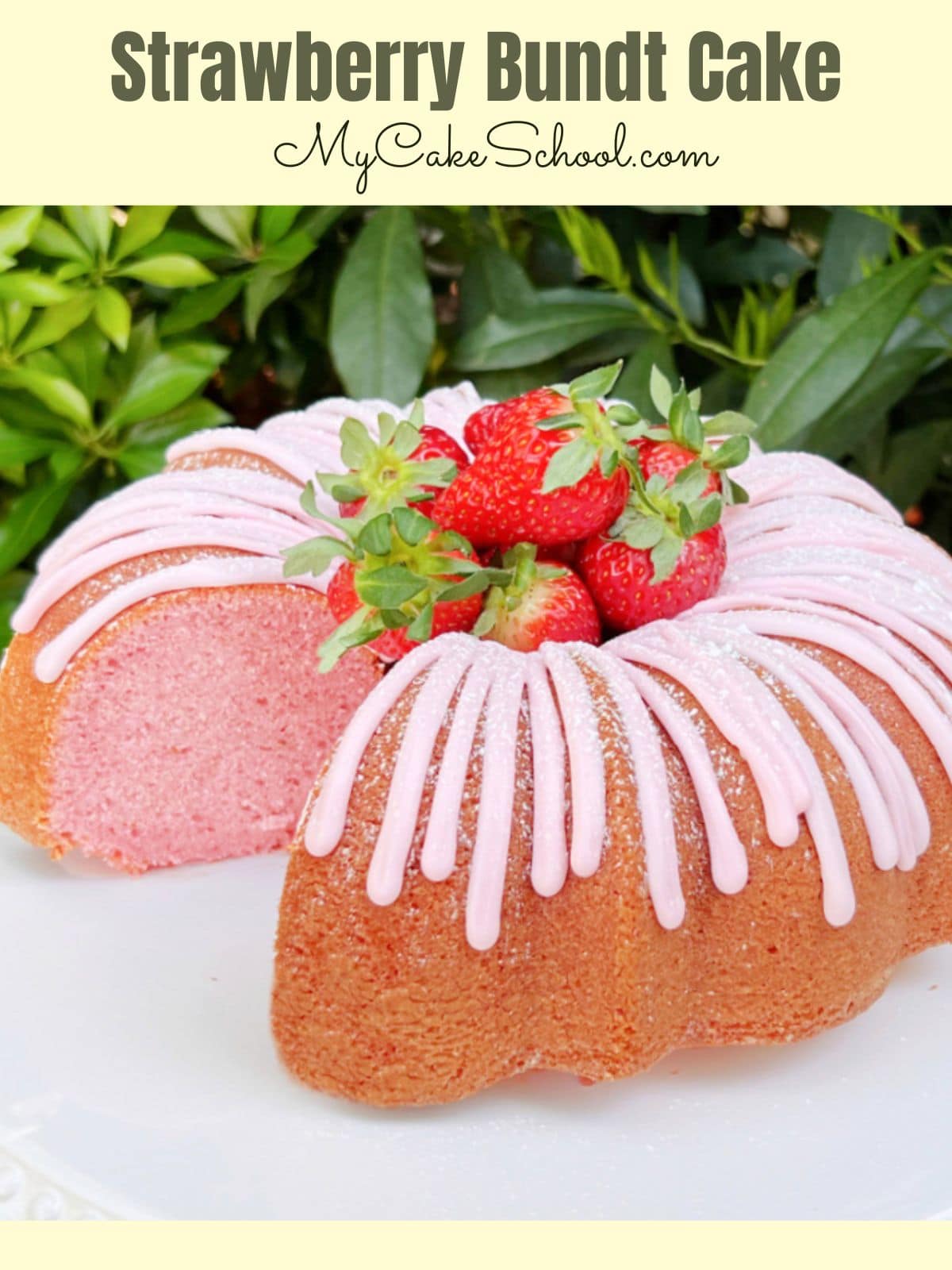Sliced Strawberry Bundt Cake, with strawberry glaze and topped with fresh strawberries.