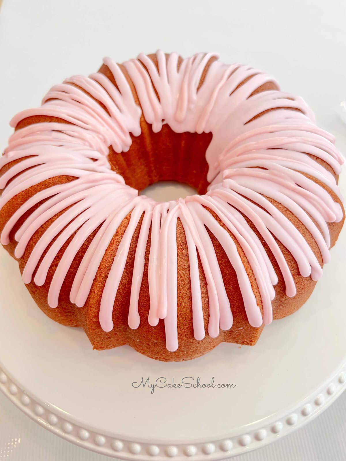 Strawberry bundt cake topped with strawberry glaze