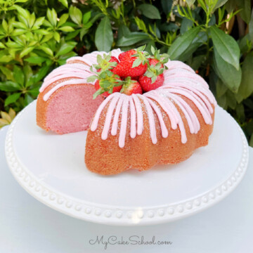 Sliced Strawberry Bundt Cake on White Pedestal.