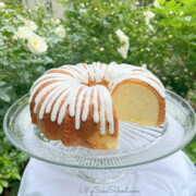 Buttermilk Pound Cake, sliced, on a pedestal