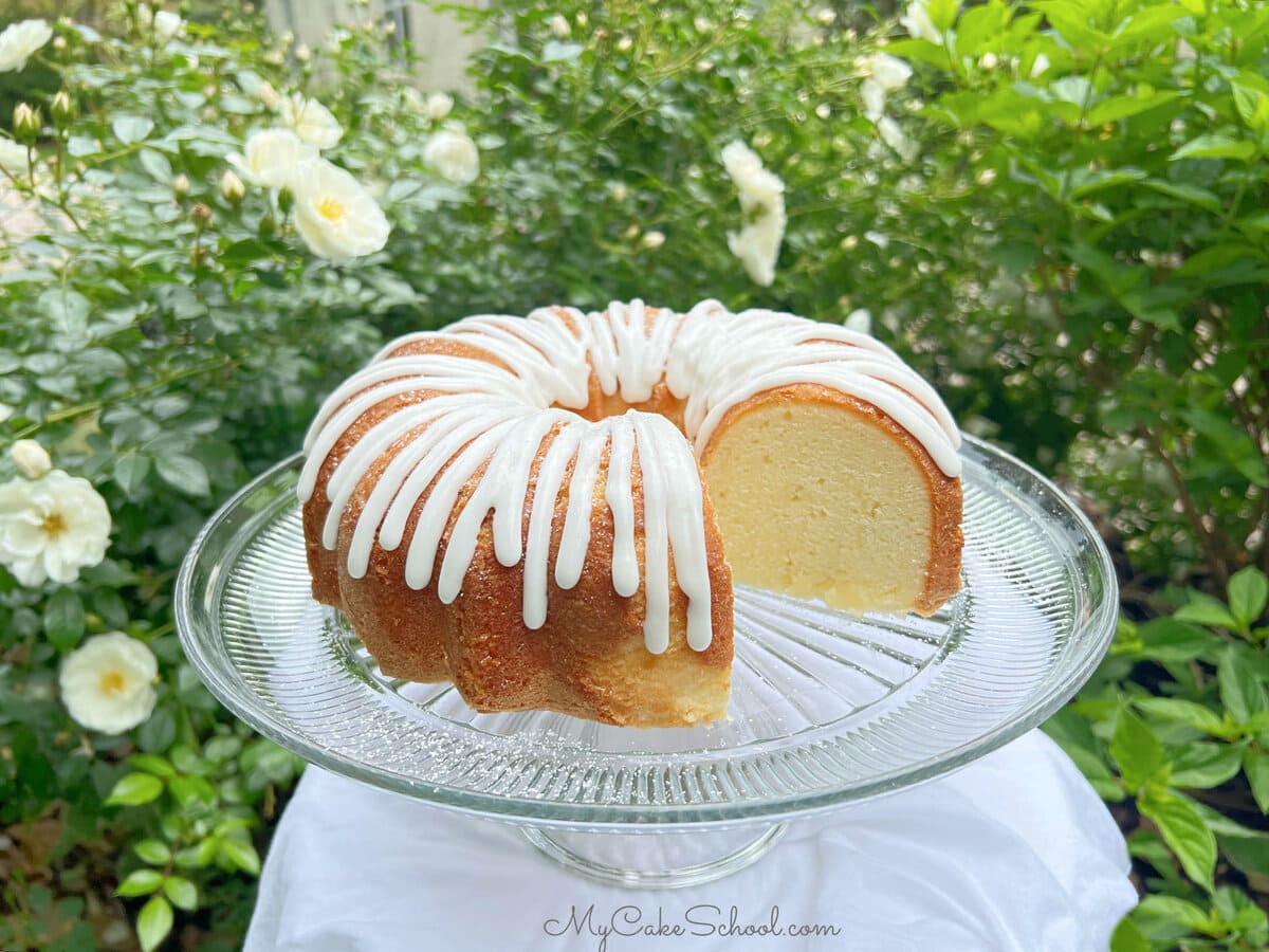 Buttermilk Pound Cake, sliced, on a pedestal