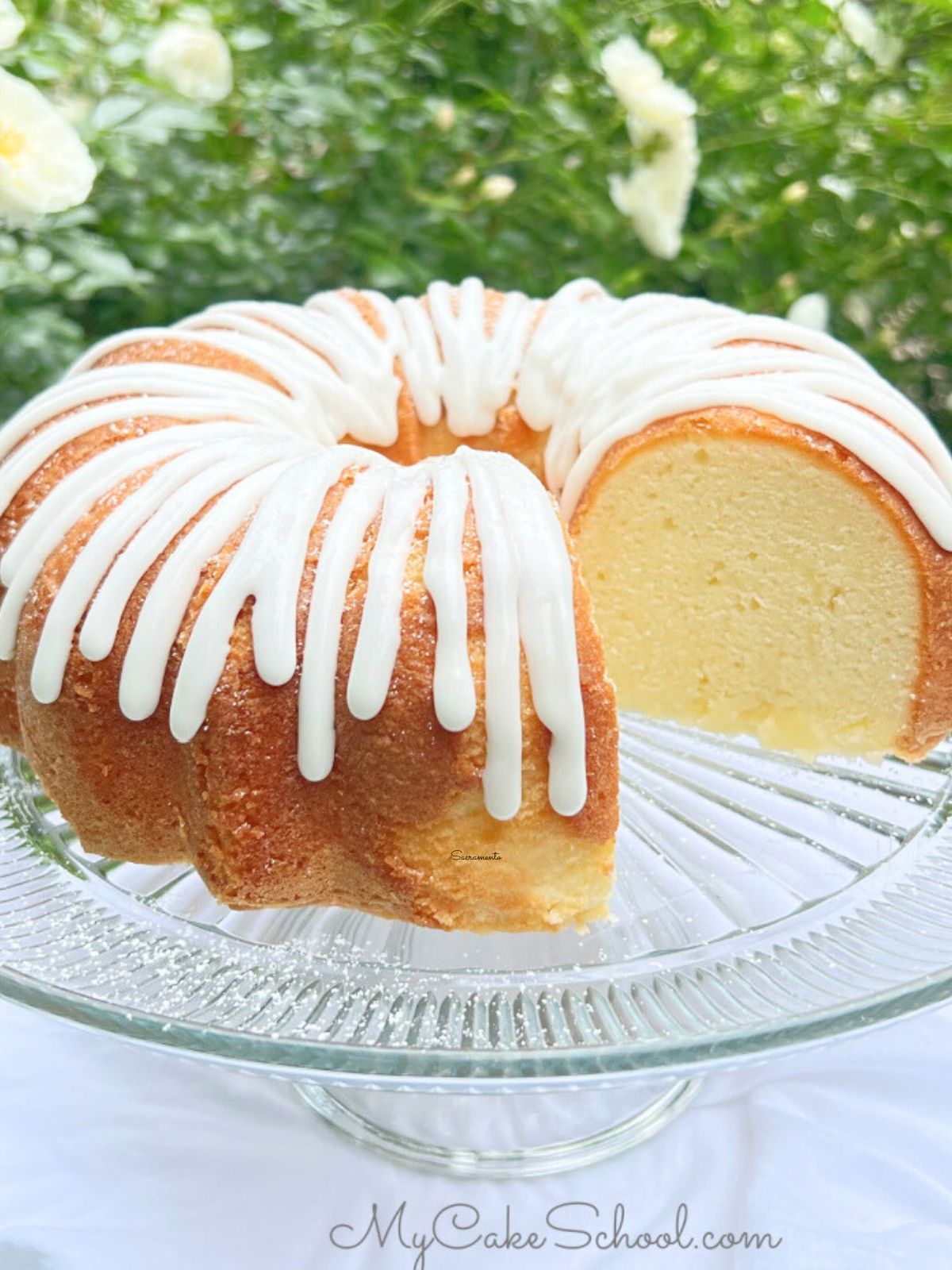 Buttermilk Pound Cake resting on a glass glaze.