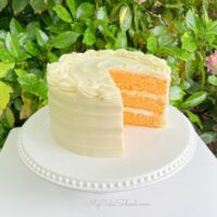 Orange Cake, sliced on a pedestal