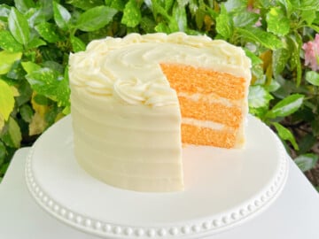 Orange Cake, sliced on a pedestal