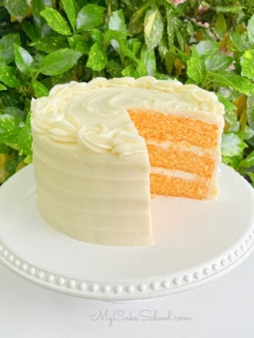 Orange Cake, sliced on a pedestal