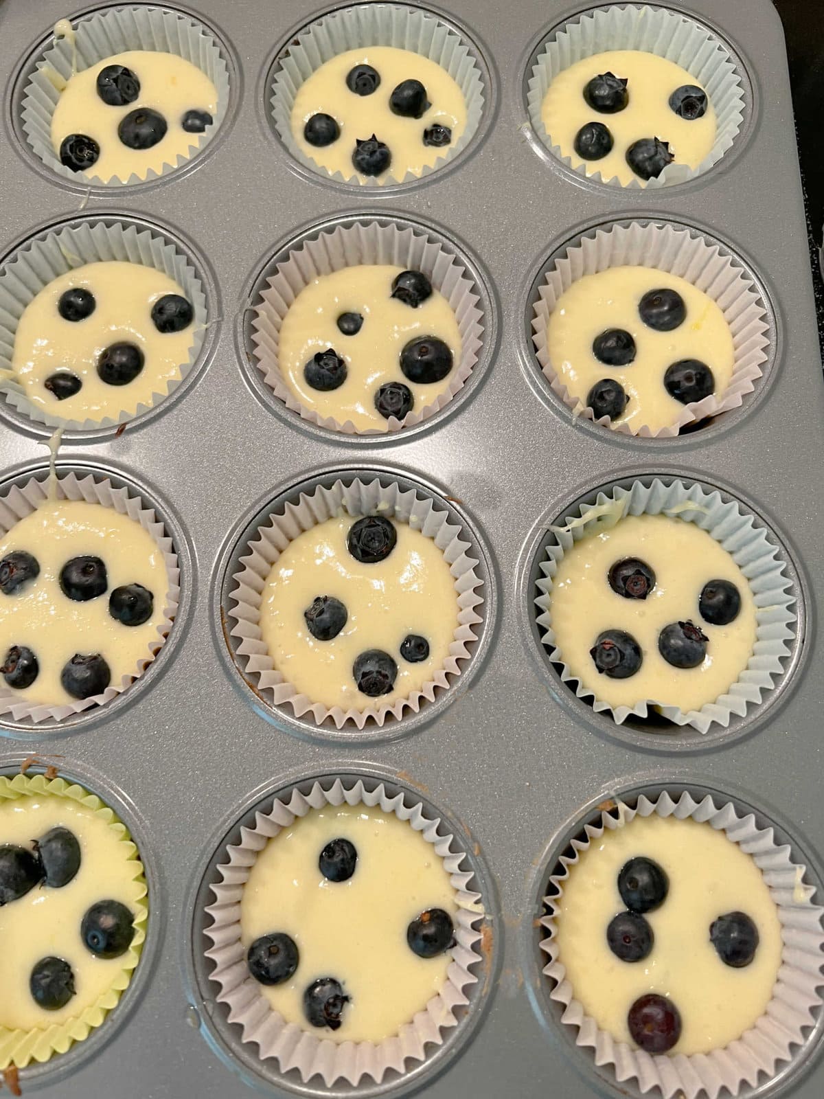 Lemon Blueberry Cupcake Batter in the liners