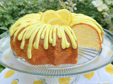 Sliced Lemonade Cake on pedestal