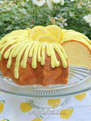 Sliced Lemonade Cake on pedestal