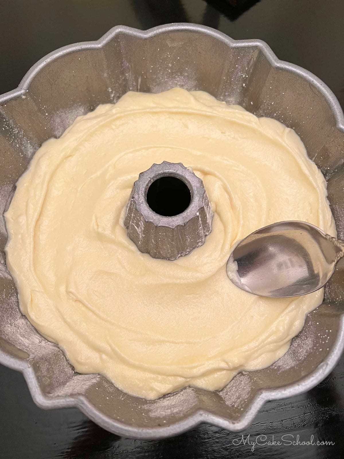 Smoothing lemonade cake batter with smooth in bundt pan
