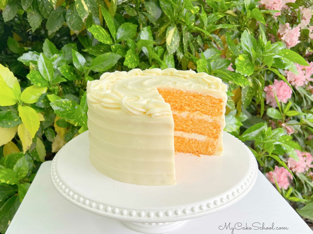 Sliced Orange Cake on Pedestal