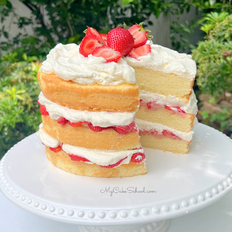 Strawberry Shortcake Cake on a white pedestal