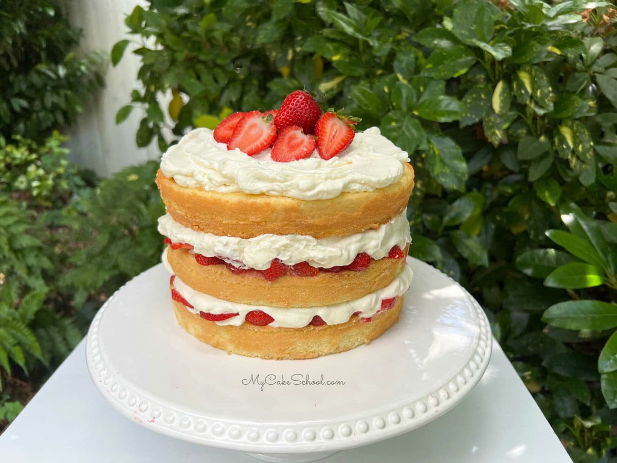 Strawberry Shortcake on white cake pedestal