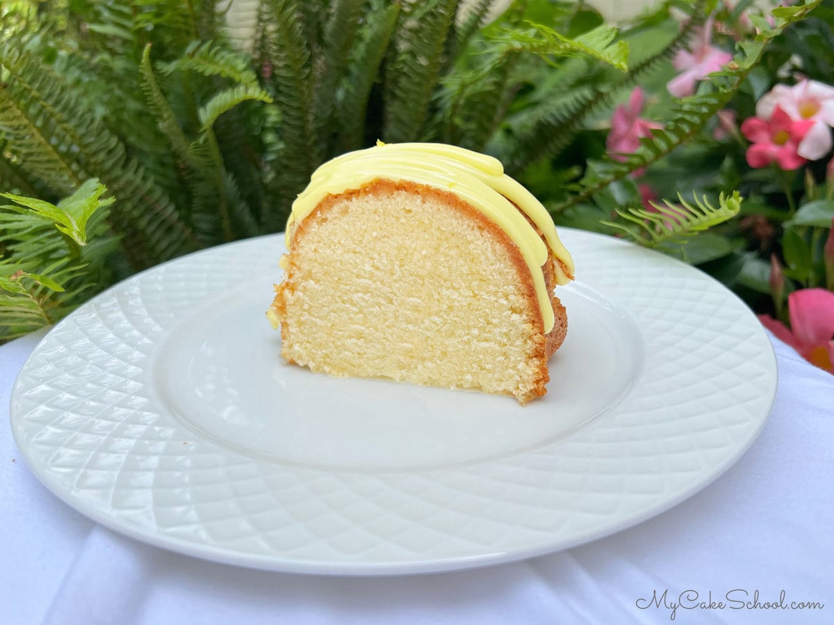 Slice of Lemonade Cake on a white plate