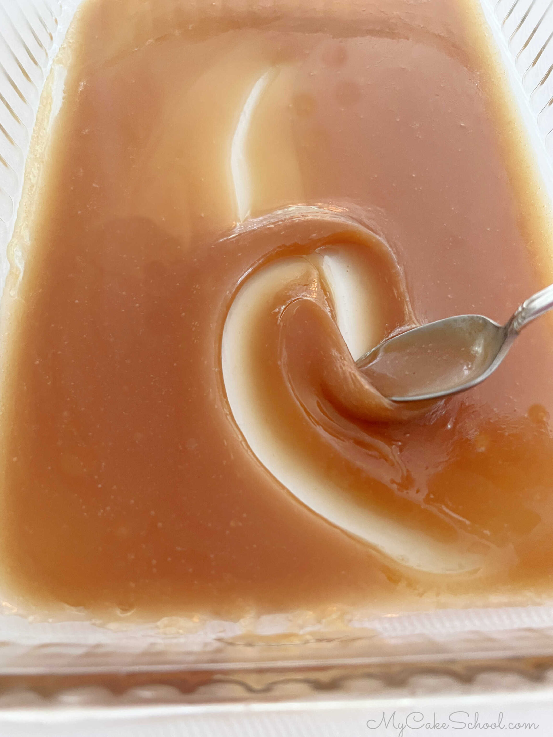 Caramel sauce, cooling in a glass casserole dish. 