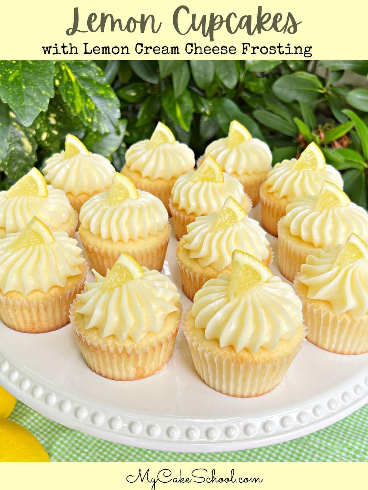 Lemon Cupcakes topped with Lemon Cream Cheese Frosting, on a white cake pedestal