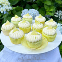 Margarita Cupcakes on white pedestal, against background of hyndrangeas.
