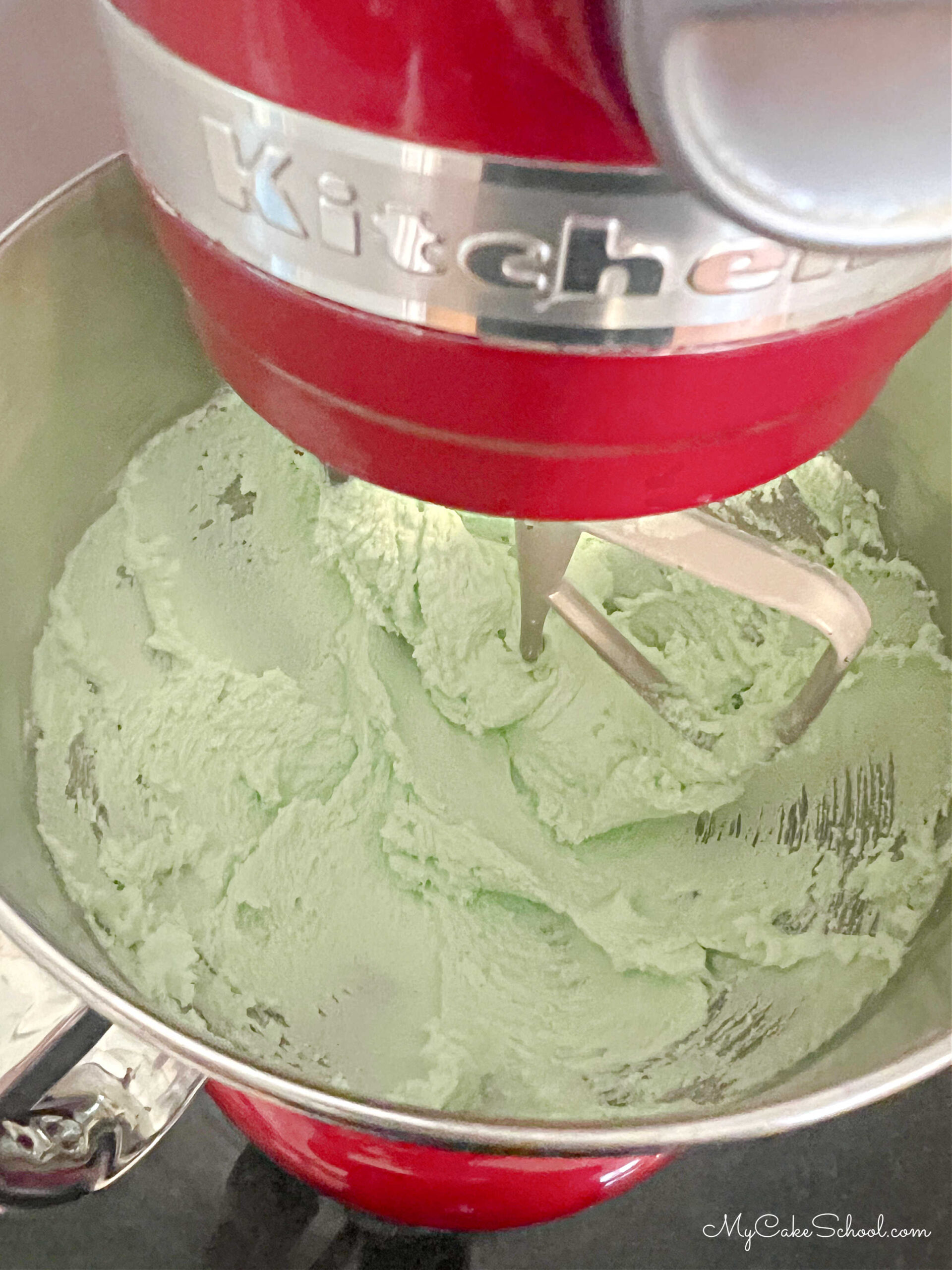 Mixing bowl with butter, sugar, and lime jello mixture