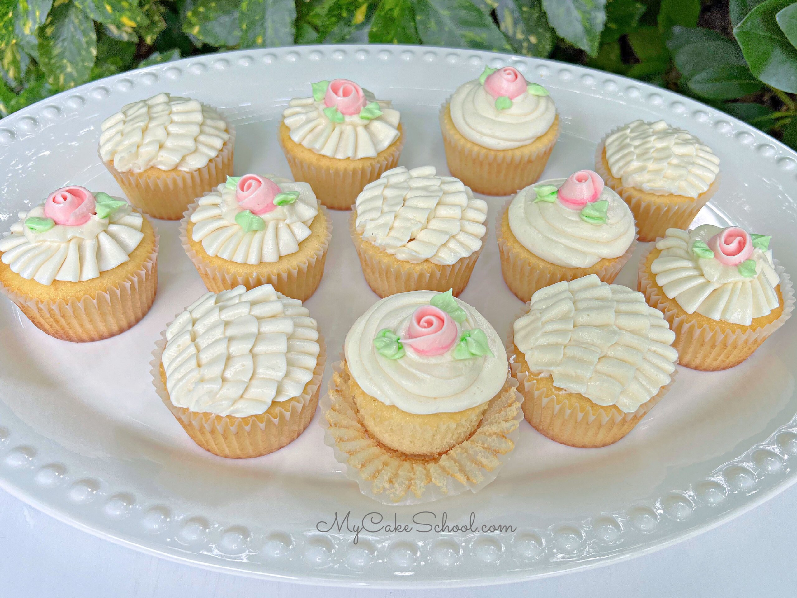 Platter of Vanilla Cupcakes, frosted with buttercream ruffles and roses