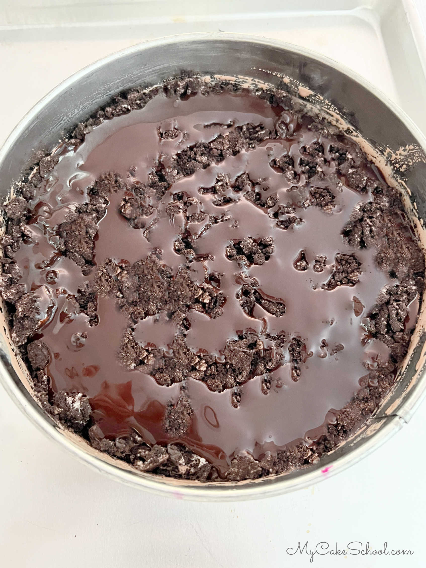 Layer of crushed Oreos and hot fudge