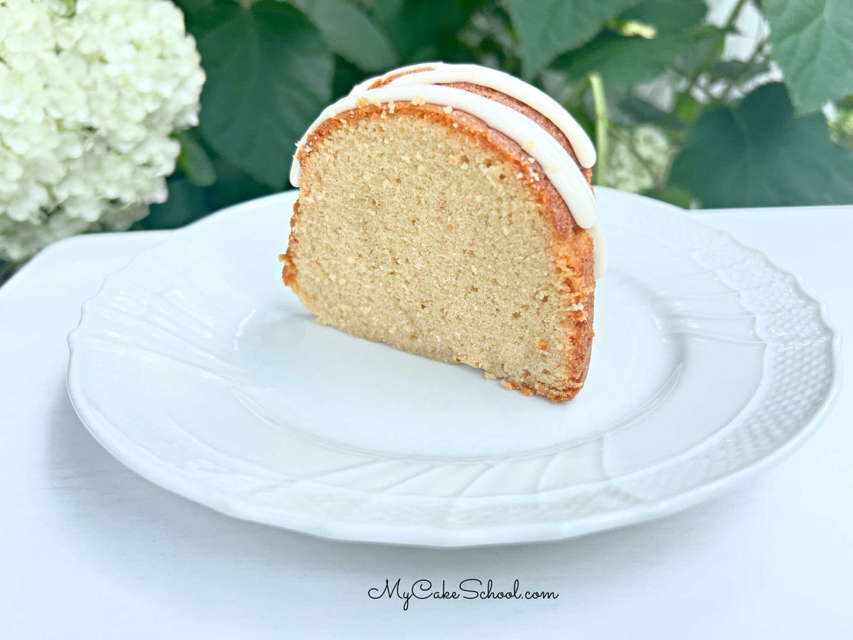 Slice of honey cake on white plate