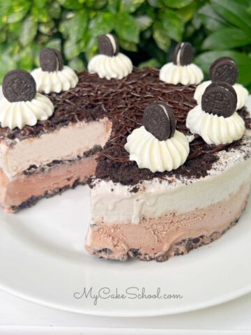 Oreo Ice Cream Cake, sliced, on a white platter