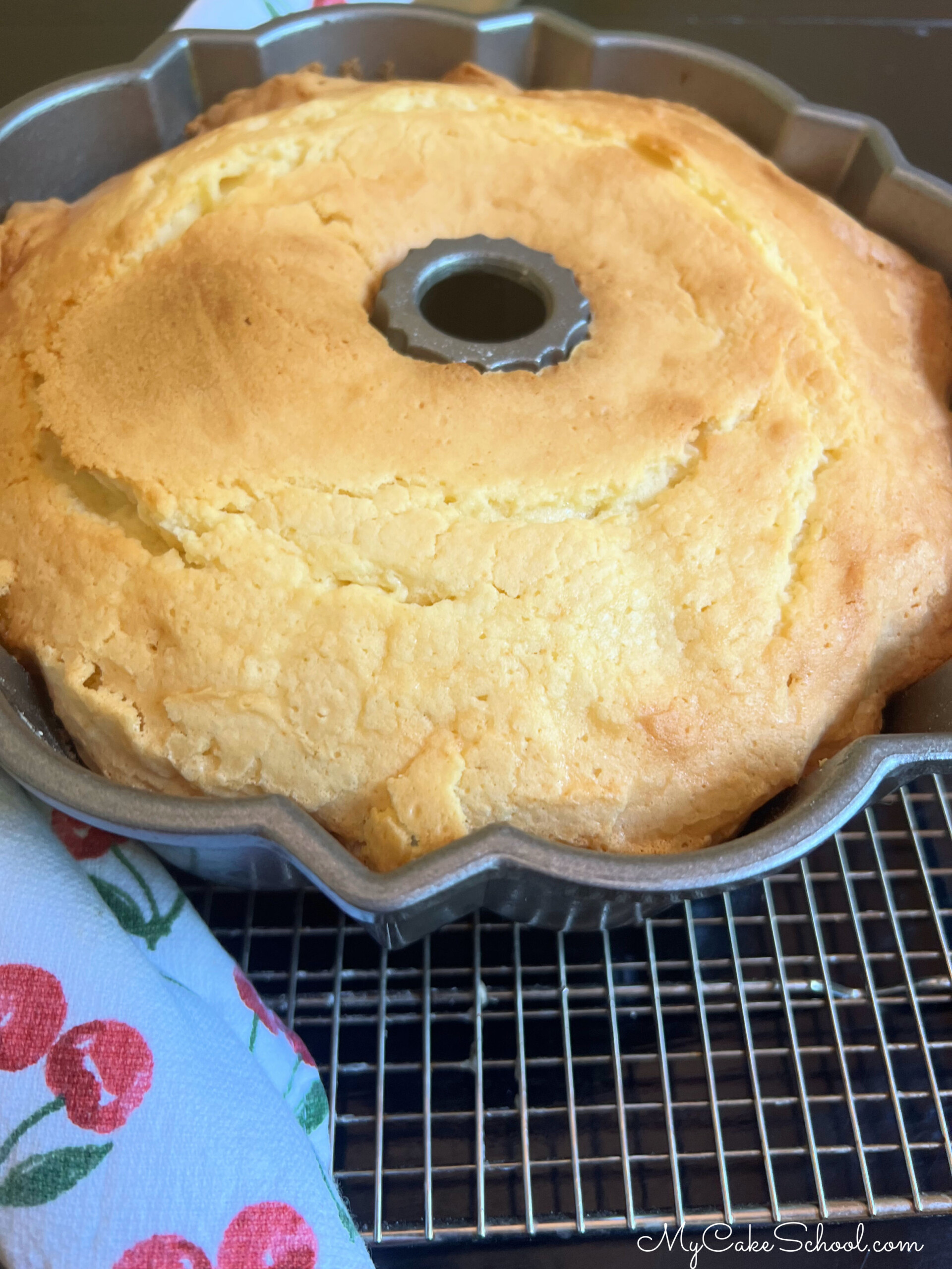 Cream Cheese Pound Cake, freshly baked, in pan. Cooling on wire rack.