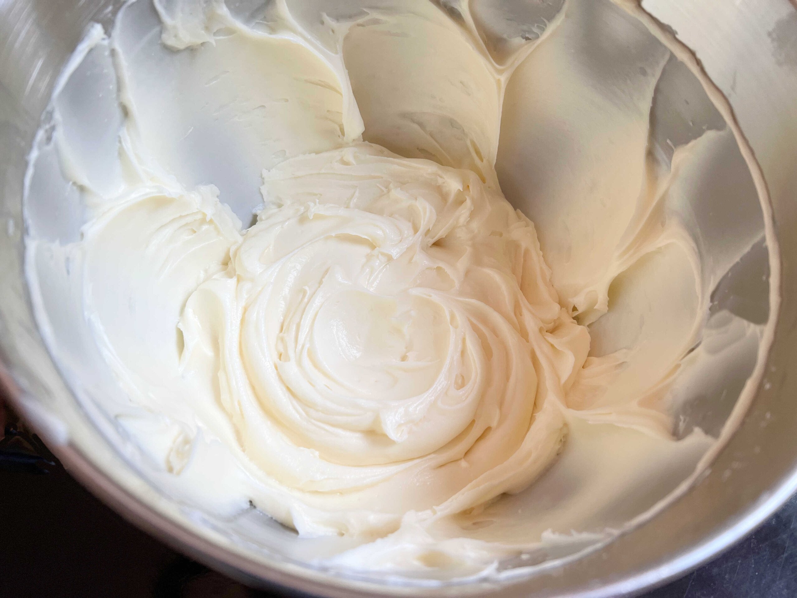 Bowl of cream cheese frosting.