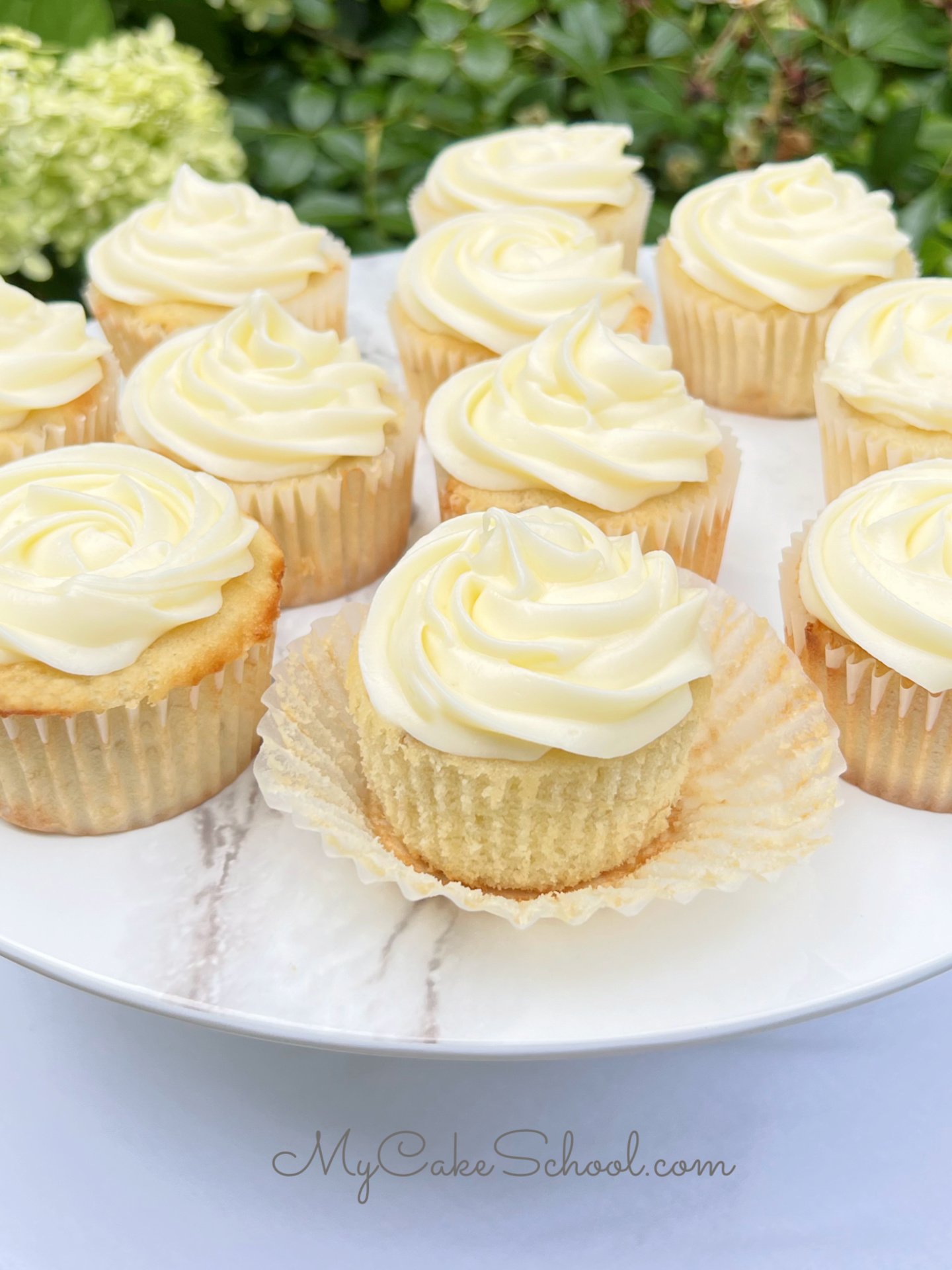 Banana Cupcakes on a pedestal.