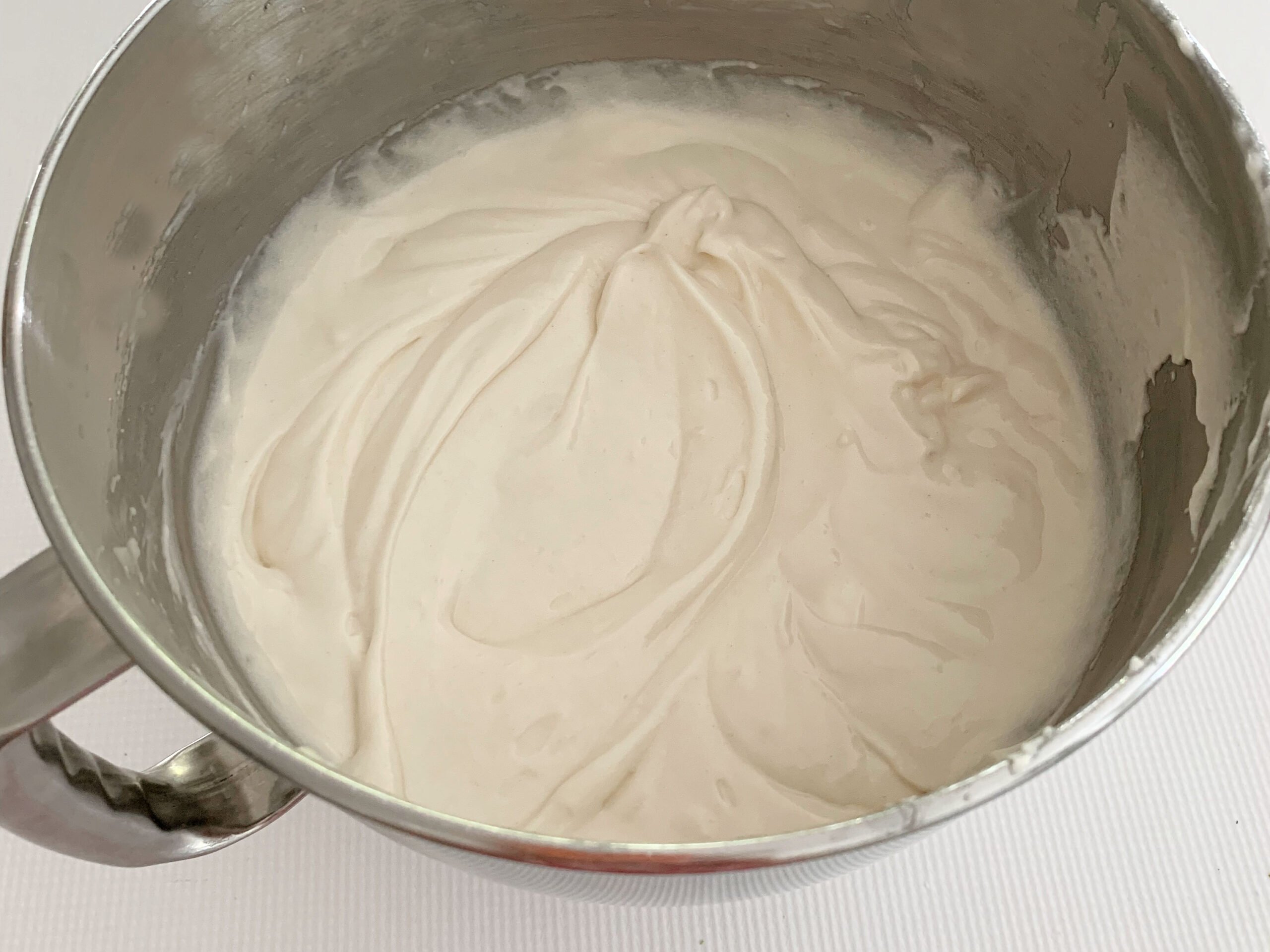 Mixing bowl of white cake batter
