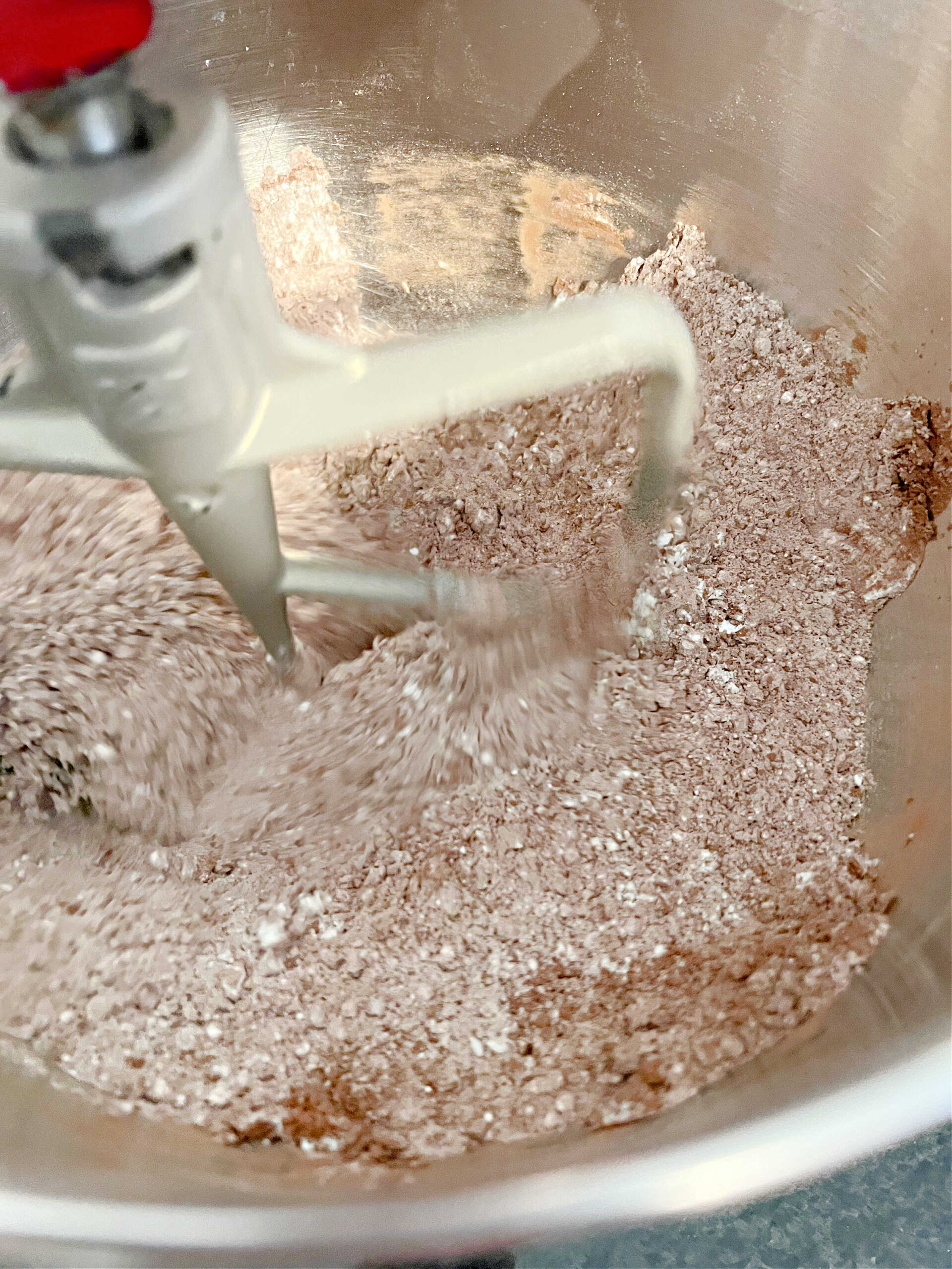 Dry ingredients for chocolate cake in mixing bowl.