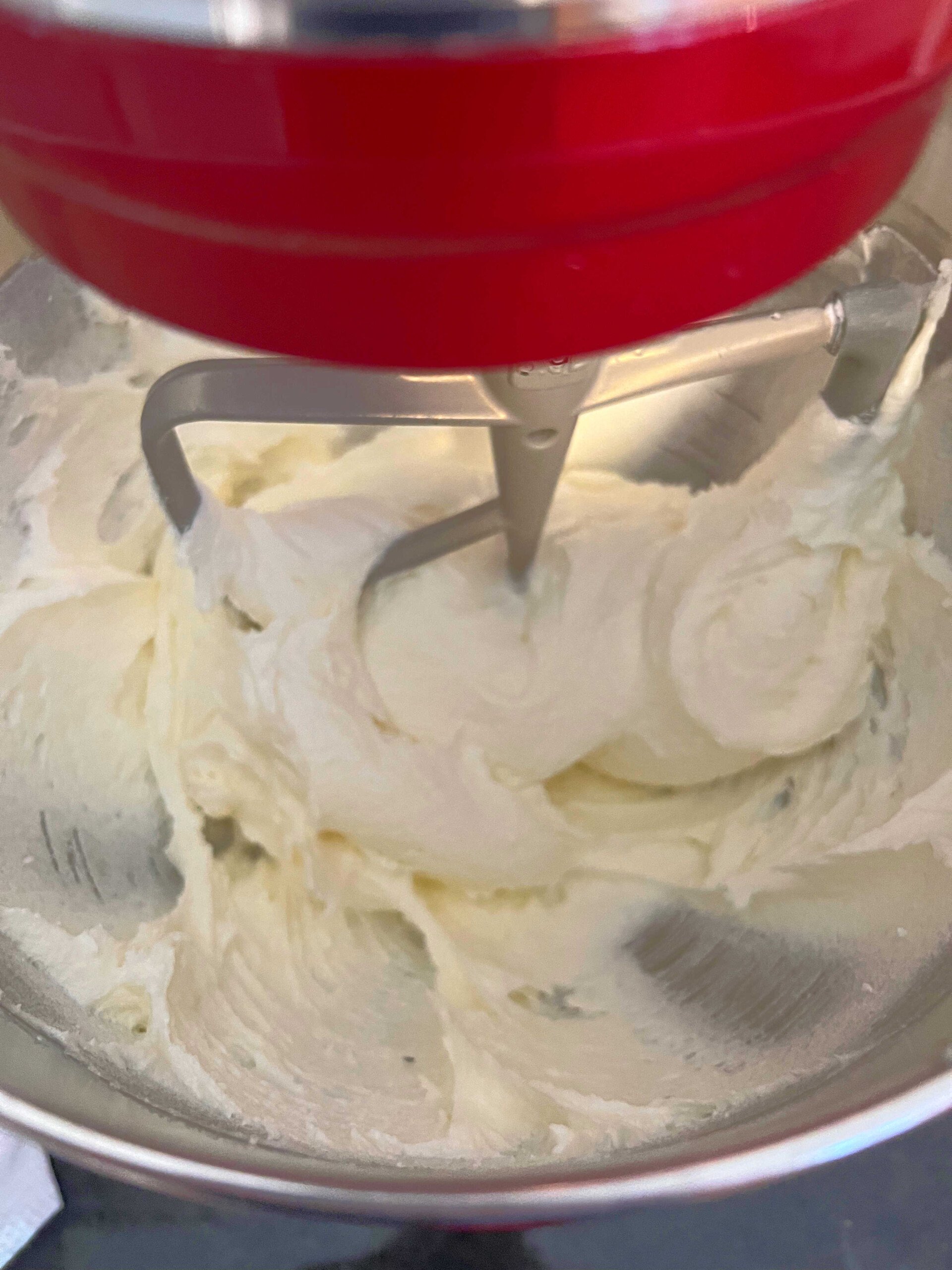 Sugar, butter, and cream cheese, mixing in the stand mixer.