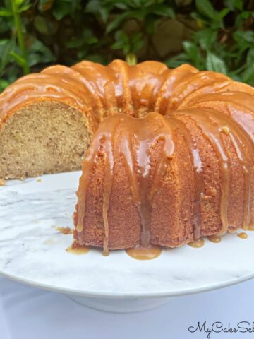 Banana Pound Cake, sliced, on a pedestal.