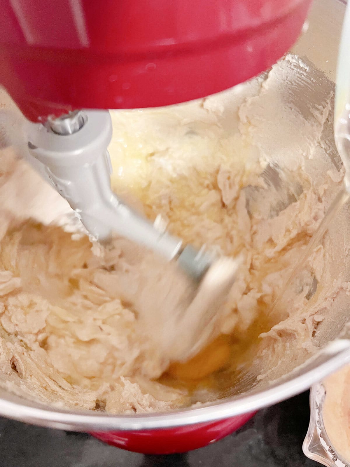 Adding eggs to Maple Pound Cake Batter.