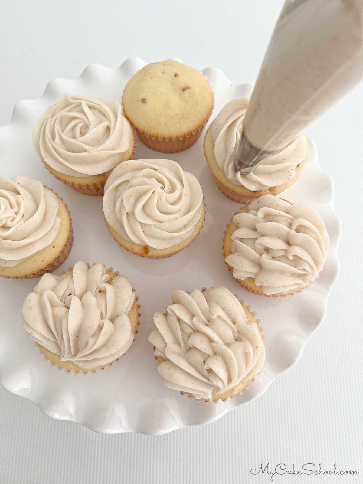 Decorating the Snickerdoodle Cupcakes.