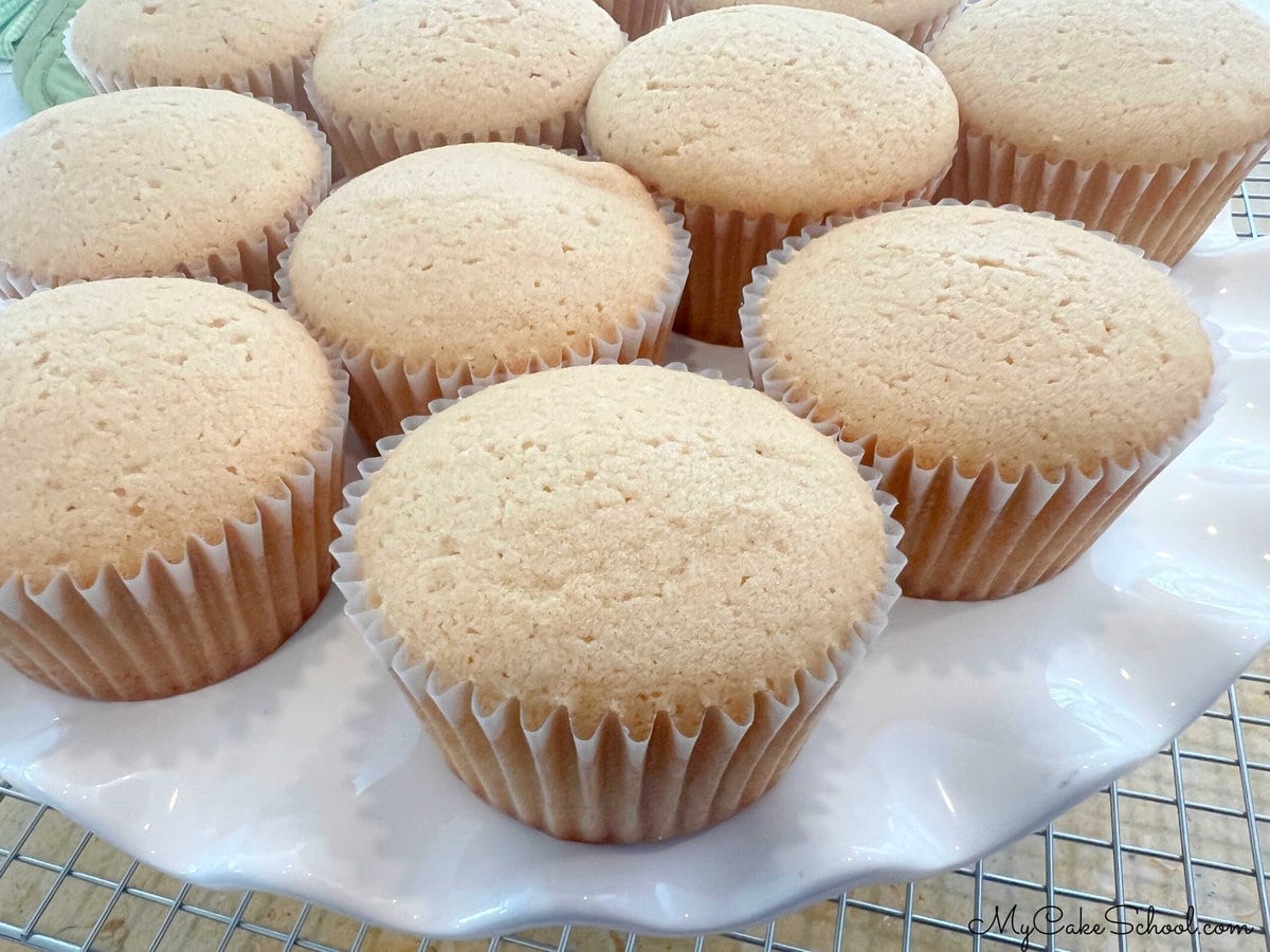 Caramel Cupcakes (before frosting) on cake pedestal.