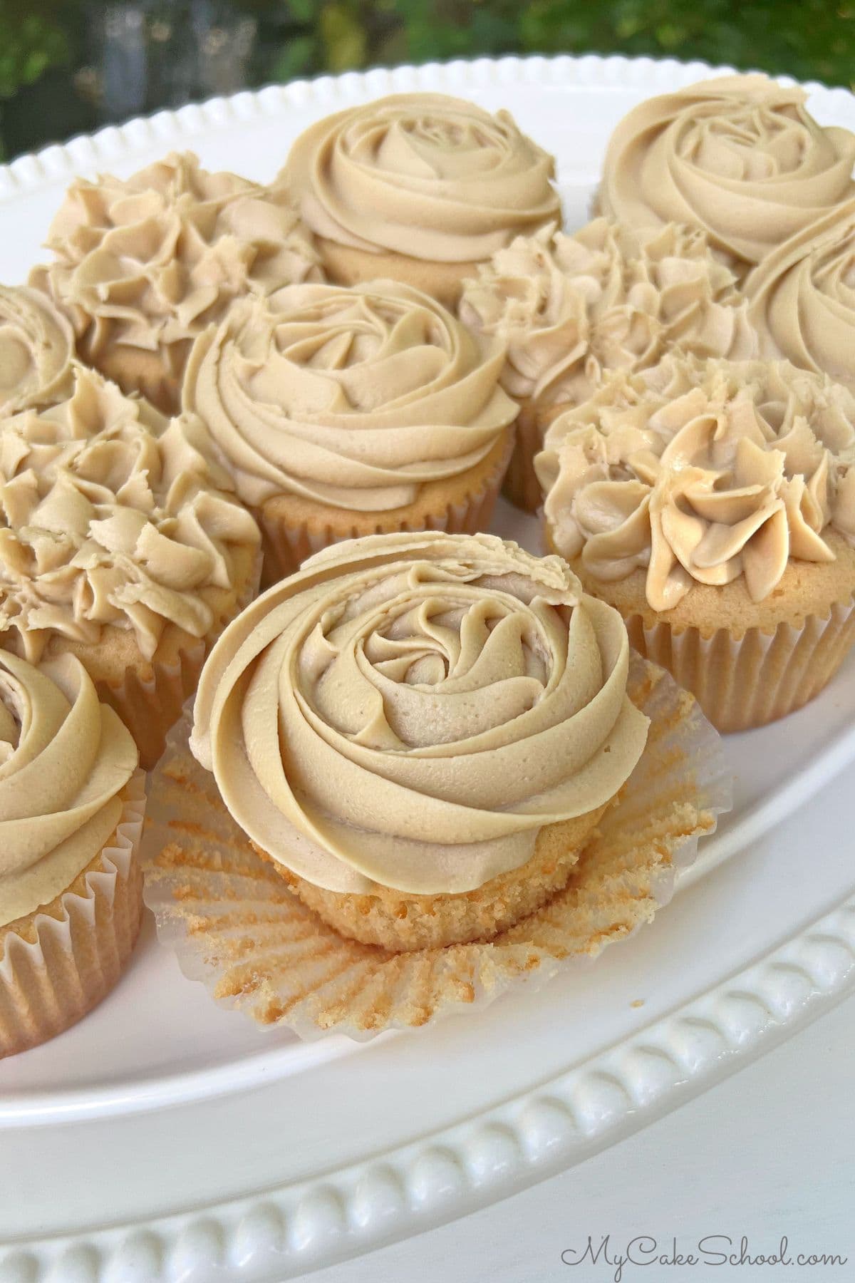 Platter of caramel cupcakes with caramel frosting