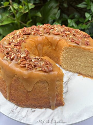 Maple Pound Cake, sliced, on a cake pedestal.