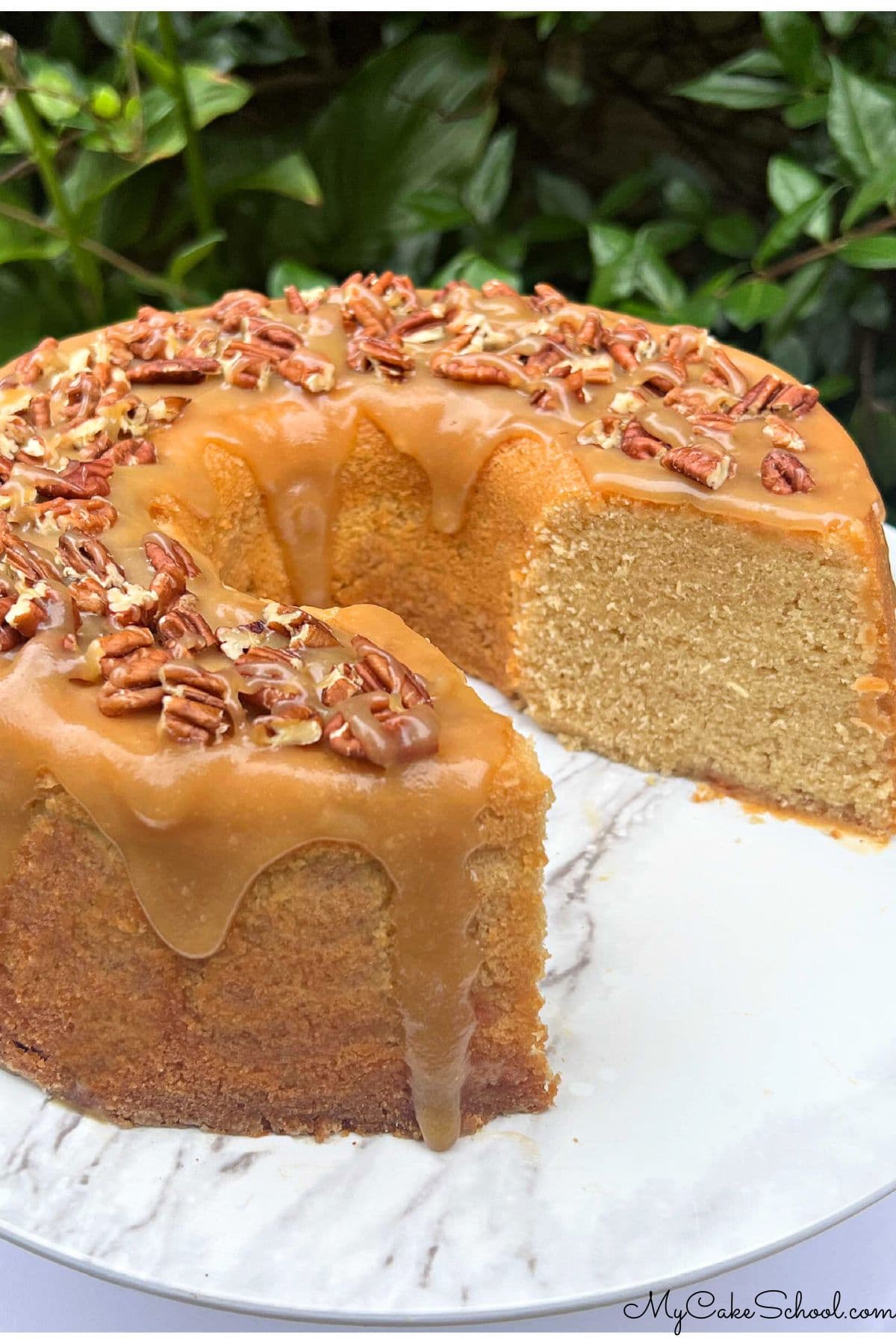 Sliced Maple Pound Cake on a pedestal.