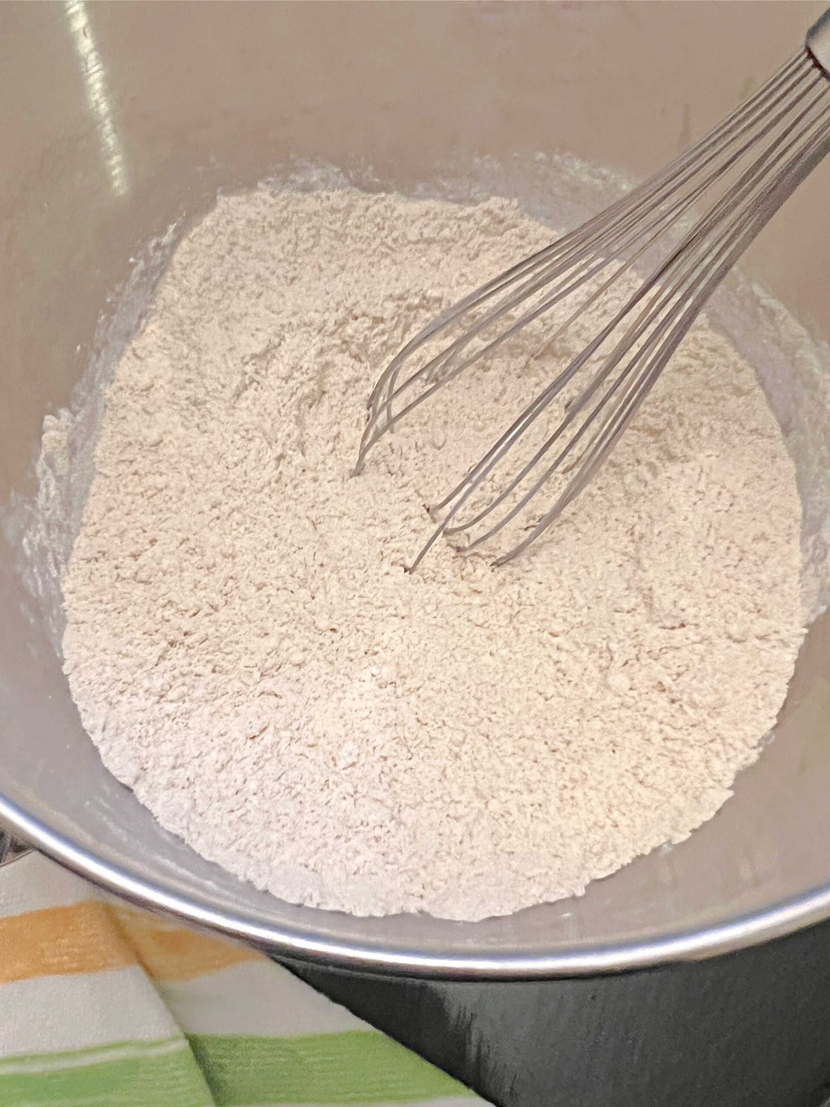 Dry ingredients in mixing bowl for banana rum cake.