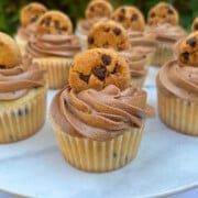 Chocolate Chip Cupcakes, topped with chocolate frosting and mini chocolate chip cookies.