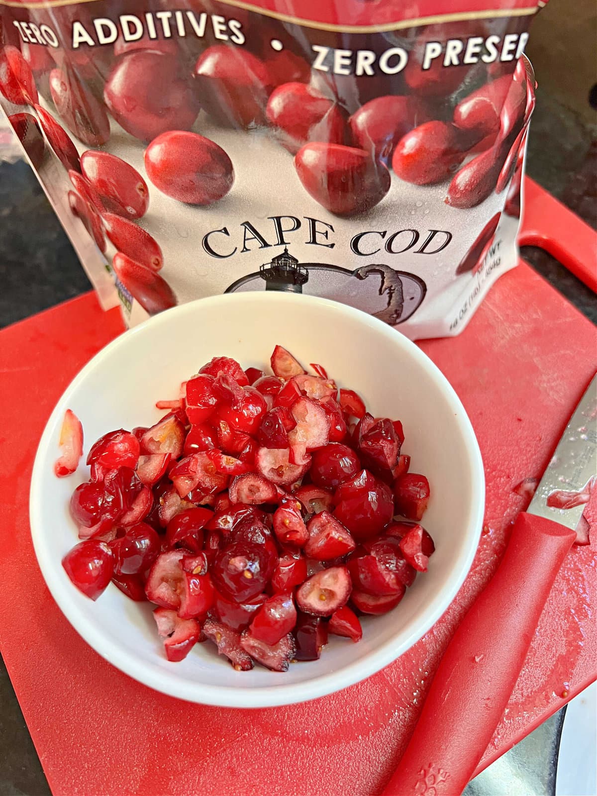 Bowl of sliced cranberries.