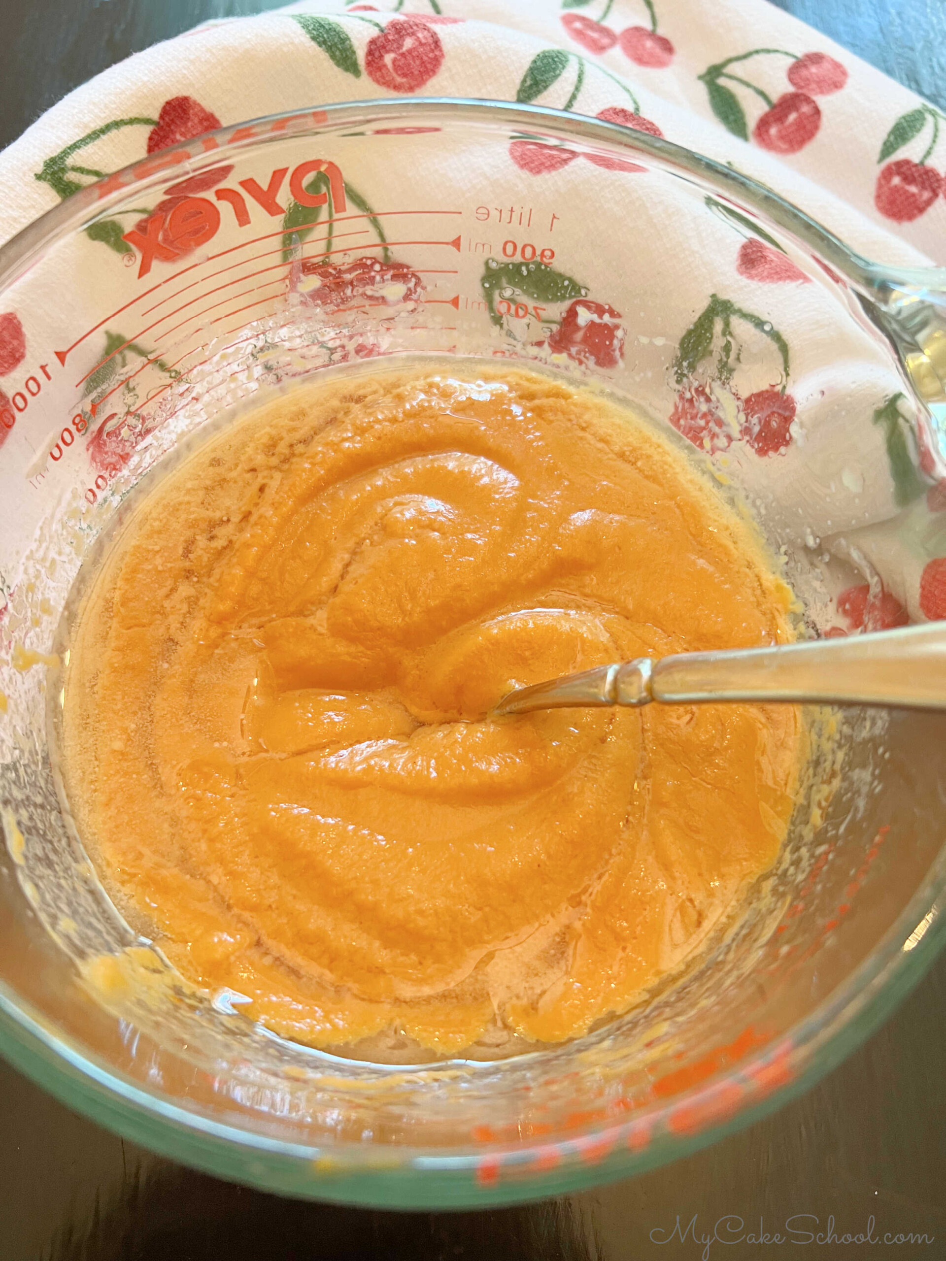 Mixture of the wet ingredients for the sweet potato cupcakes in a glass bowl.