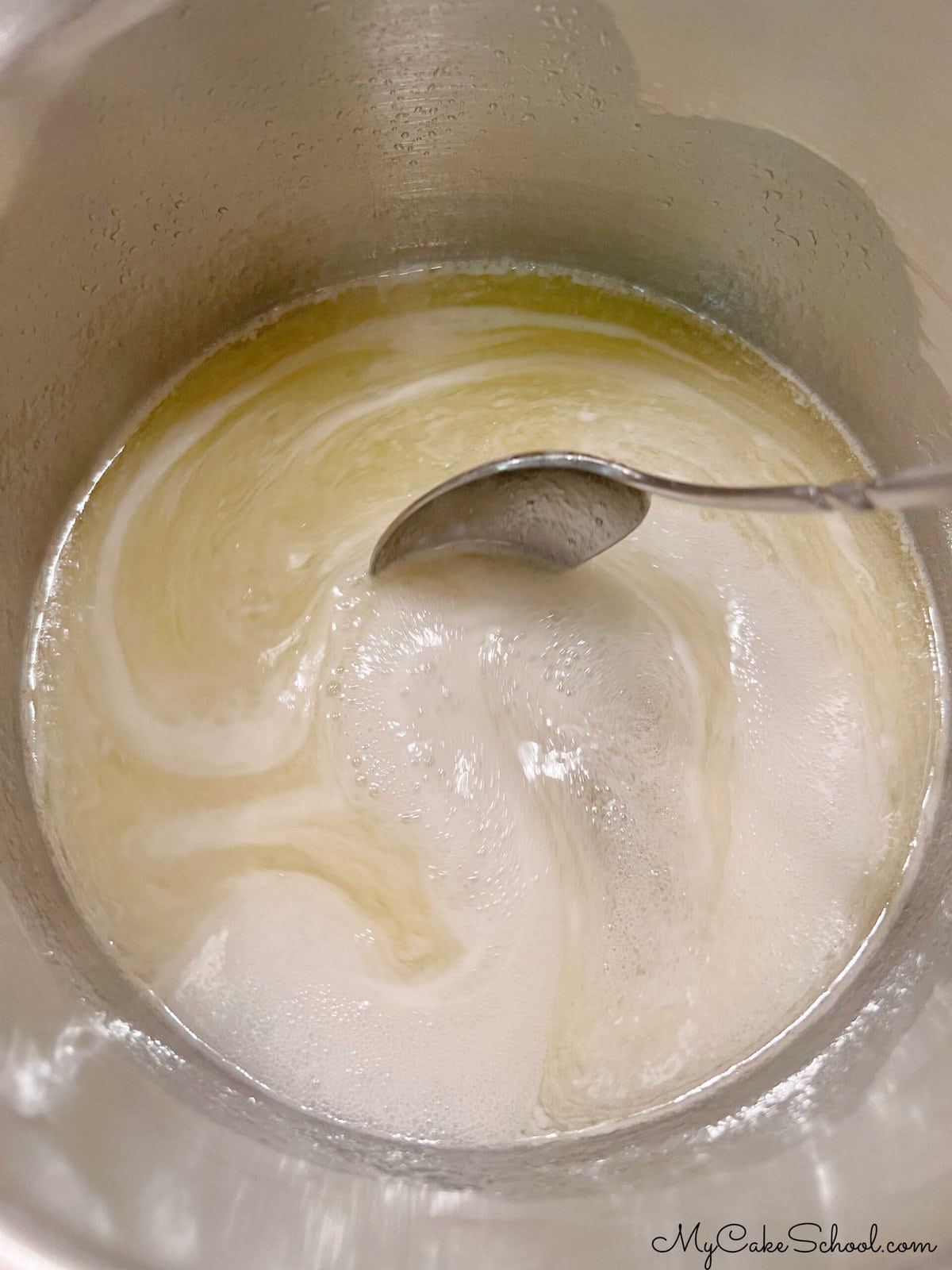 Heating the rum glaze mixture in a saucepan.