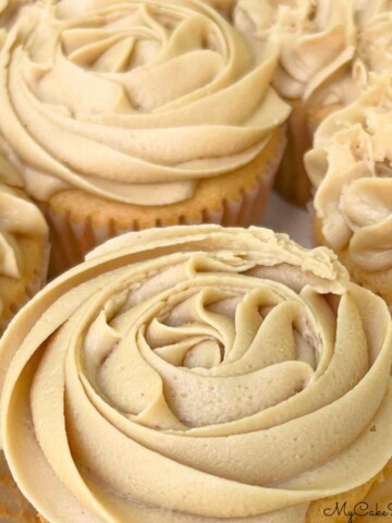 Closeup of Cupcakes topped with caramel frosting.