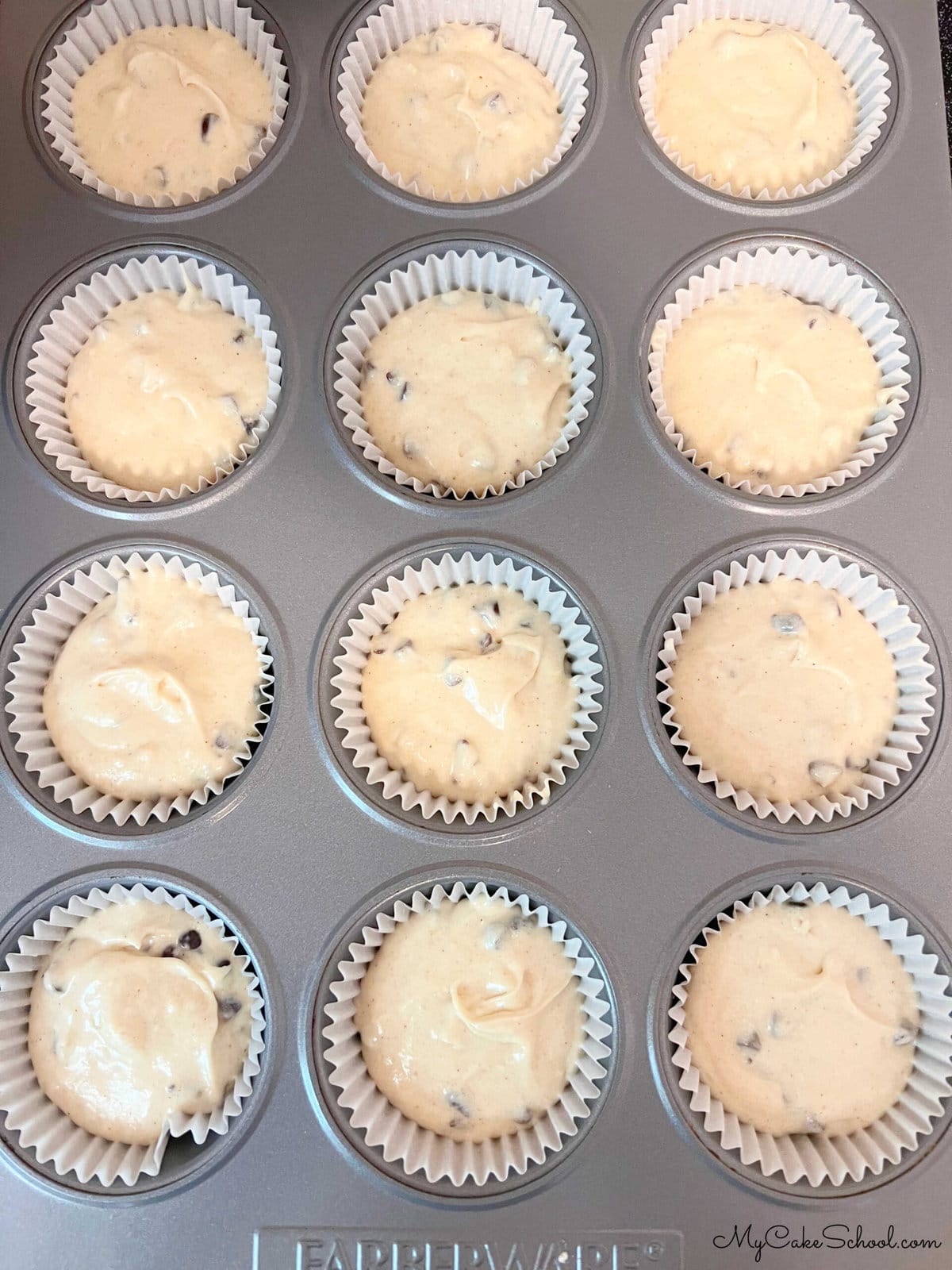 Chocolate Chip Cupcake Batter-filled cupcake liners, in pan.