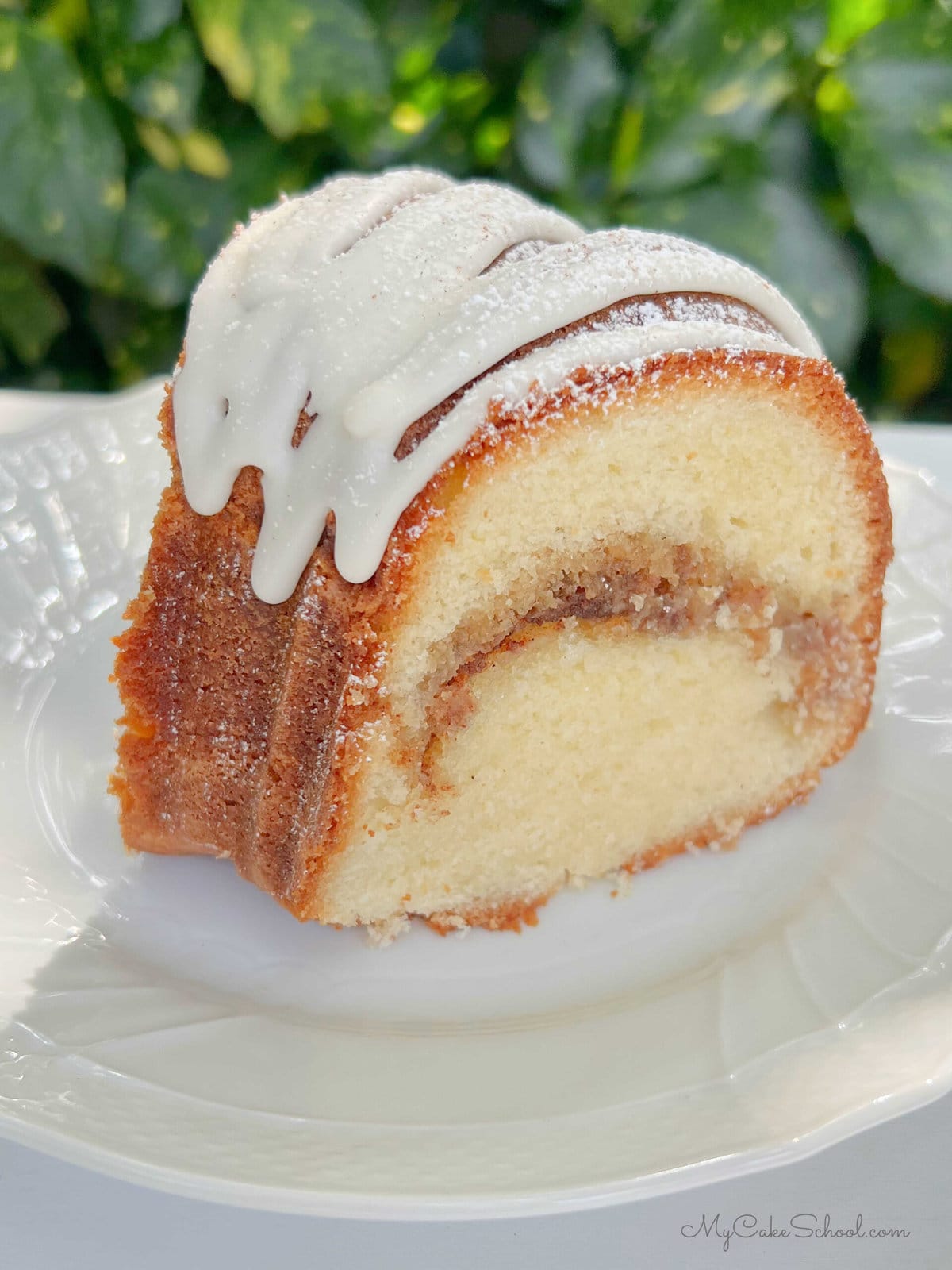 Slice of Snickerdoodle Bundt Cake on a plate.