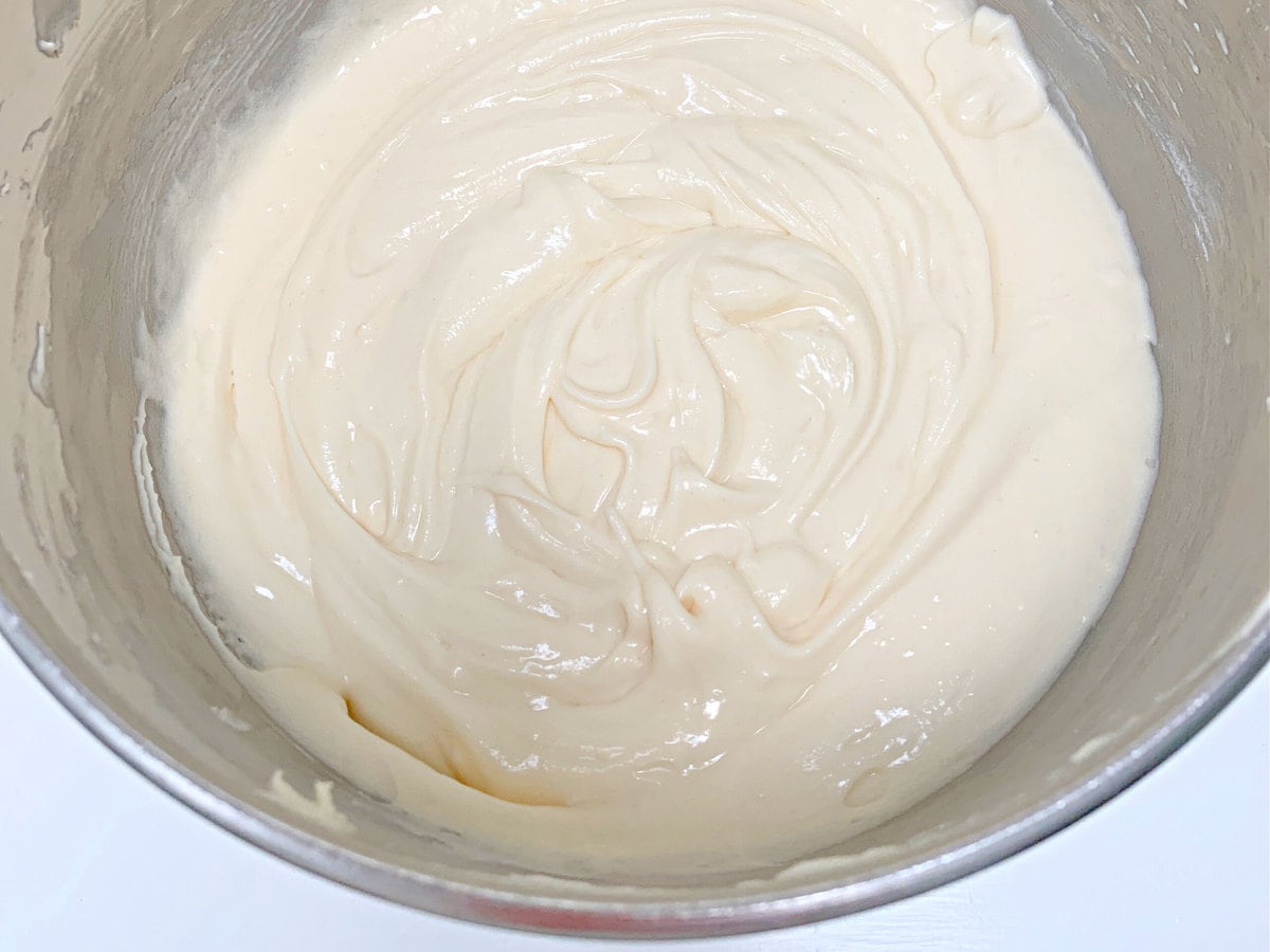 Mixing bowl of vanilla batter for snickerdoodle cake. 