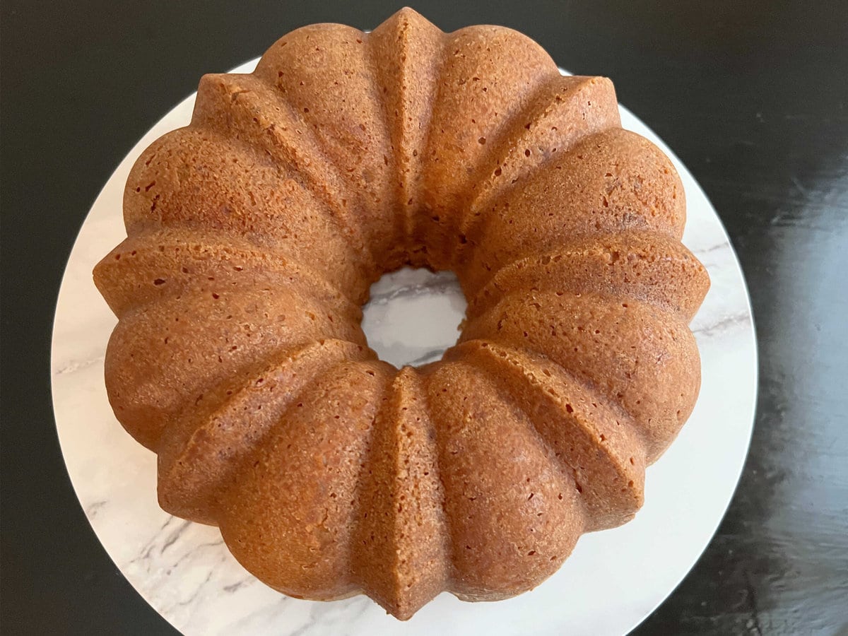 Butter Pecan Pound Cake on pedestal, before glazing with caramel.