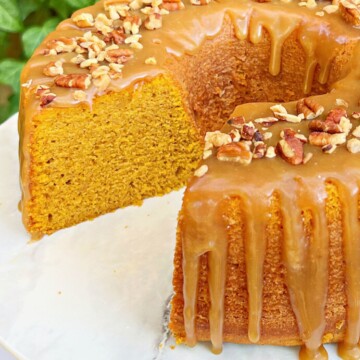 Sliced Pumpkin Bundt Cake on a cake pedestal.